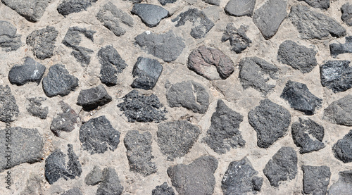Cobblestone pavement texture as background. Close-up.