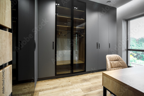 Modern gray scandinavian loft wood walk in closet with wardrobe