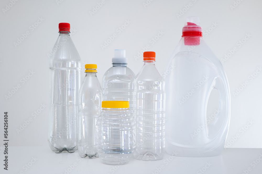 Variety of empty transparent plastic bottles without a label, ready to be recycled. Close up studio shot, no people Variety of empty transparent plastic bottles without a label, ready to be recycled. Close up studio shot, no people