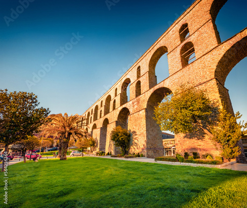 Colorful spring cityscape of Kavala city with medieval aqueduct Kamares. Spectacular spring morning in the Macedonia region, Greece, Europe. Traveling concept background. photo