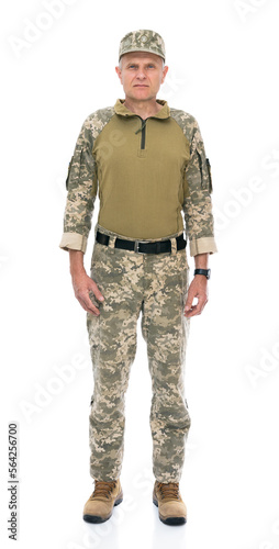 Ukraine army soldier isolated on white background. Full length portrait of old defender seriously looking into the distance and posing in studio. Stand for Ukraine.