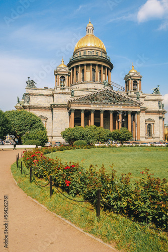 Panoramic view on Saint Isaac's Cathedral. Isaakievskiy Sobor with green lawn and red roses in summer, St. Petersburg, Russia. vertical photo. High quality photo