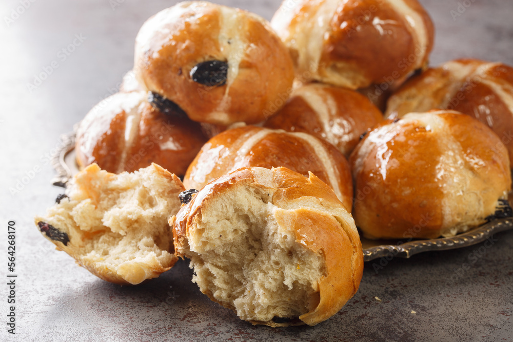 Homemade Hot Cross Buns Ready for Easter closeup on the plate on the table. Horizontal Homemade Hot Cross Buns Ready for Easter closeup on the plate on the table. Horizontal