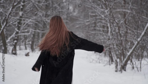 Running woman. Girl running away in the snow Forest.