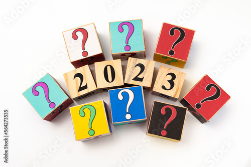 2023 with question mark written on wooden blocks isolated on white background with copy space in top view photo