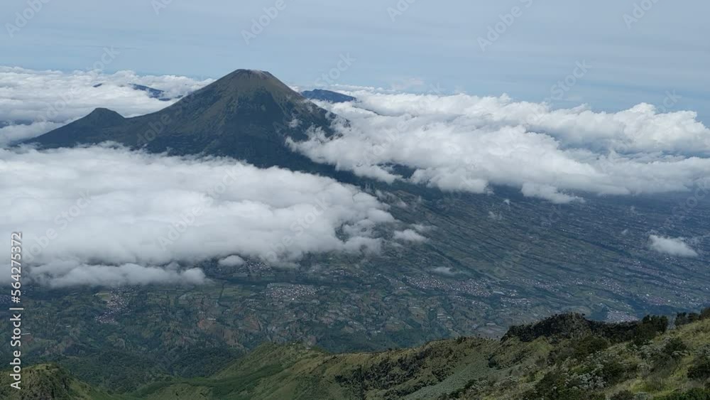 Mountain landscape with moving blue sky and white clouds in the background