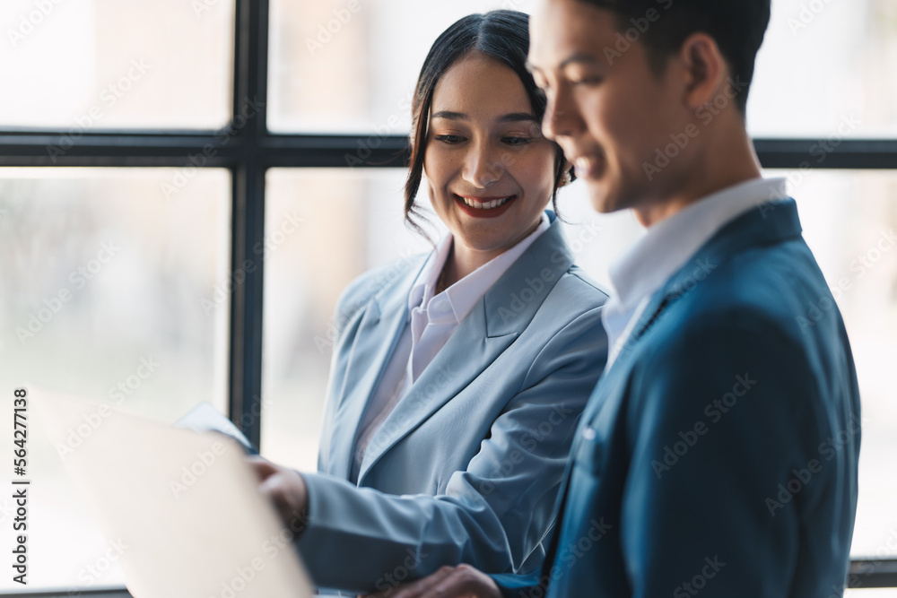 Asian successful bisiness people working todether to get their project done. Asian successful bisiness people working todether to get their project done.