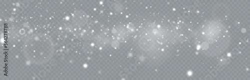 Particles of white magic dust. Shining light particles.Christmas glitter particles. Light effect on a transparent background.