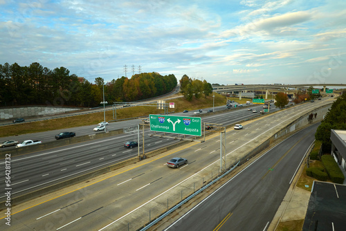 Aerial view of american freeway intersection with fast moving cars and trucks. USA transportation infrastructure concept