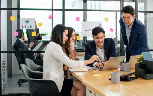 Group of business asian people wearing formal suits, talking, meeting and discussing their projects at office. Working and Teamwork Concept.