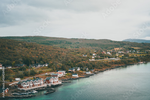 Typical norwegian houses at a fjord during a rainy day