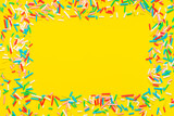 greeting wreath of colorful sprinkles on yellow background, festive invitation for Valentines day, birthday, holiday and party time