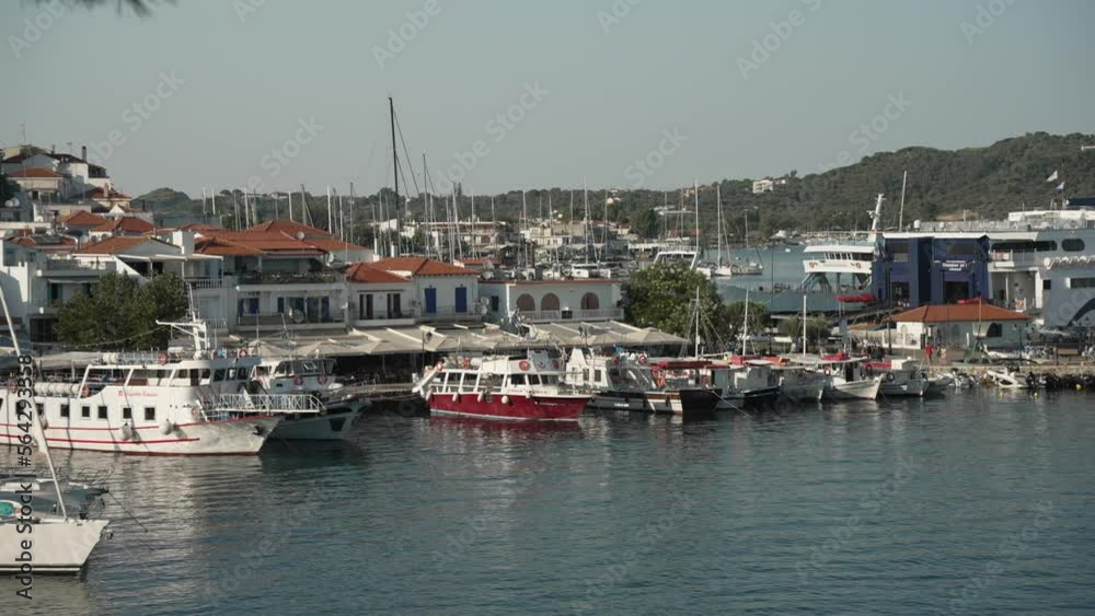 Boats in the Old Port and town, Skiathos Town, Skiathos, Sporades Islands, Greek Islands Boats in the Old Port and town, Skiathos Town, Skiathos, Sporades Islands, Greek Islands