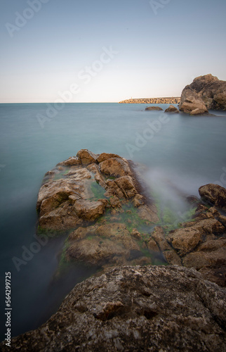 View of seascapes in long exposure technique, silky water and moving clouds with dynamic movement idea 