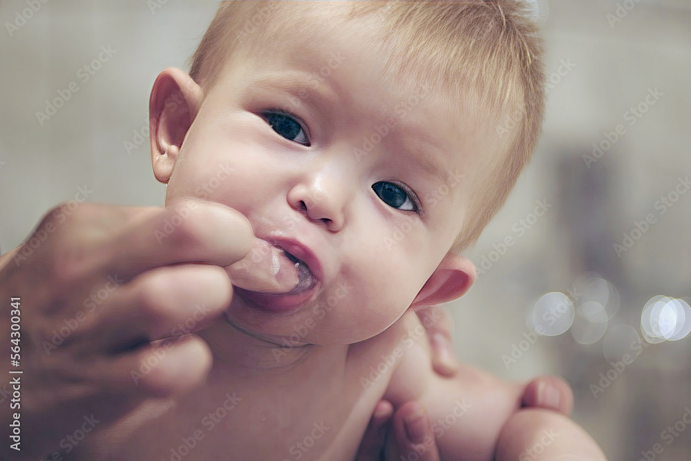 Parent helping baby with tooth brushing. Mother and baby smiling while brushing teeth. Baby's toothbrush with soft bristles Parent helping baby with tooth brushing. Mother and baby smiling while brushing teeth. Baby's toothbrush with soft bristles