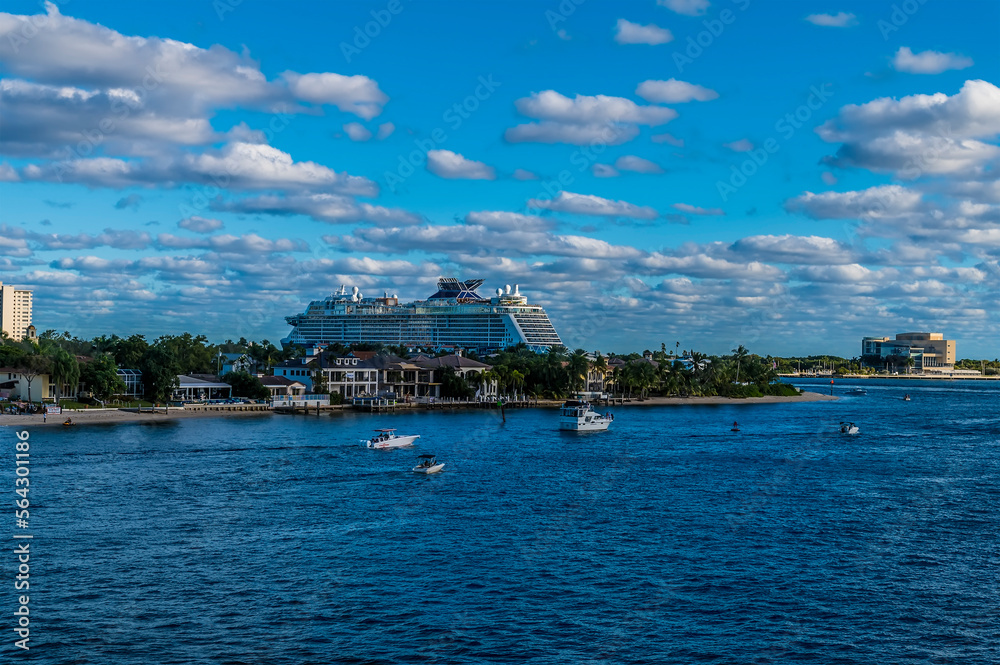 A view across Lake Mabel of a cruise ship approaching the Atlantic from Port Everglades, Fort Lauderdale on a bright sunny day