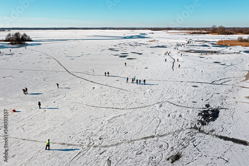 Aerial from winterfun on the Bergumer lake in Friesland the Netherlands photo