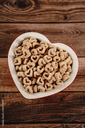Heart shaped cereal valentines day background, selective focus