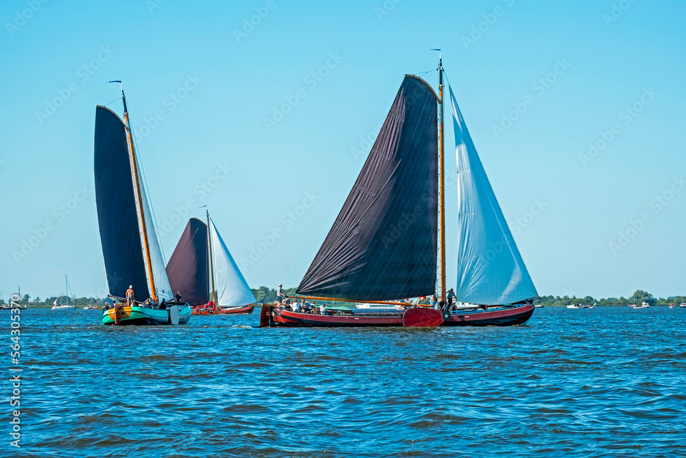 Fototapeta premium Traditional Frisian wooden sailing ships in a yearly competition in the Netherlands