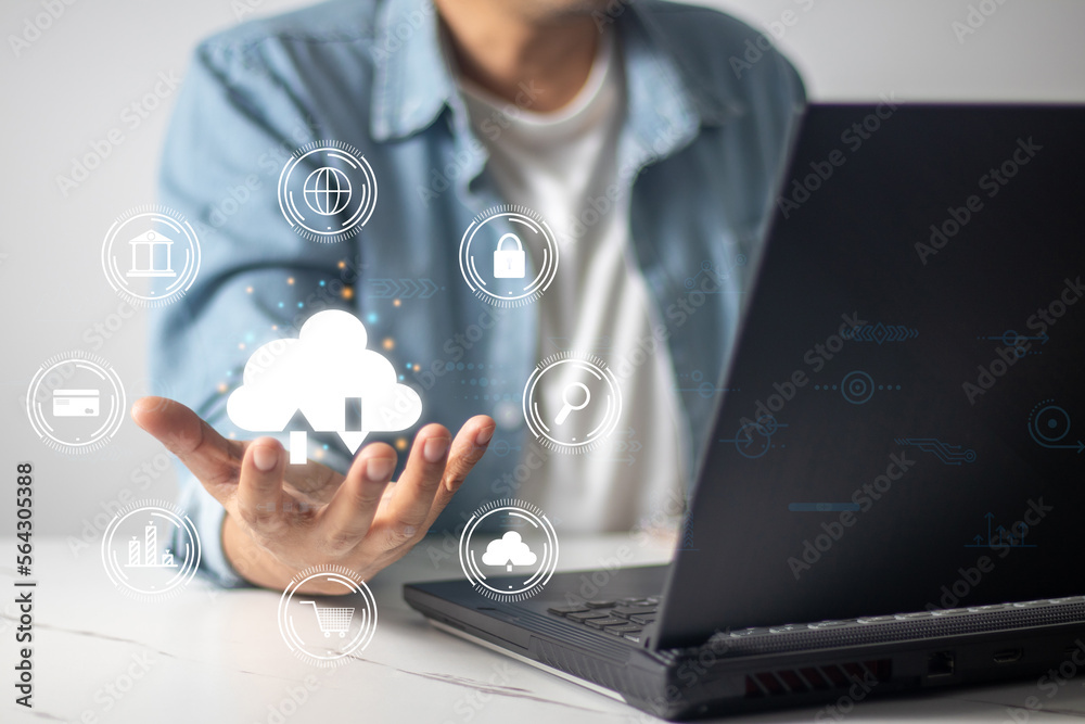 Male hand holding cloud while using computer technology concept internet online shopping banking Male hand holding cloud while using computer technology concept internet online shopping banking