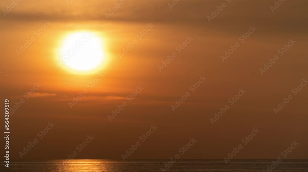 Time lapse of dramatic sunset over the sea. The sun's rays break through the clouds and are reflected in the water. Timelapse of the sun down in the sea or ocean. Time lapse of dramatic sunset over the sea. The sun's rays break through the clouds and are reflected in the water. Timelapse of the sun down in the sea or ocean.