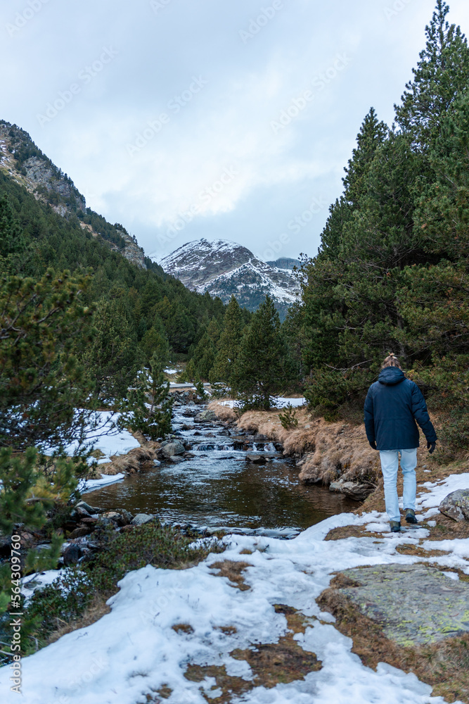 Young guy walking in nature in winter. Young guy walking in nature in winter.