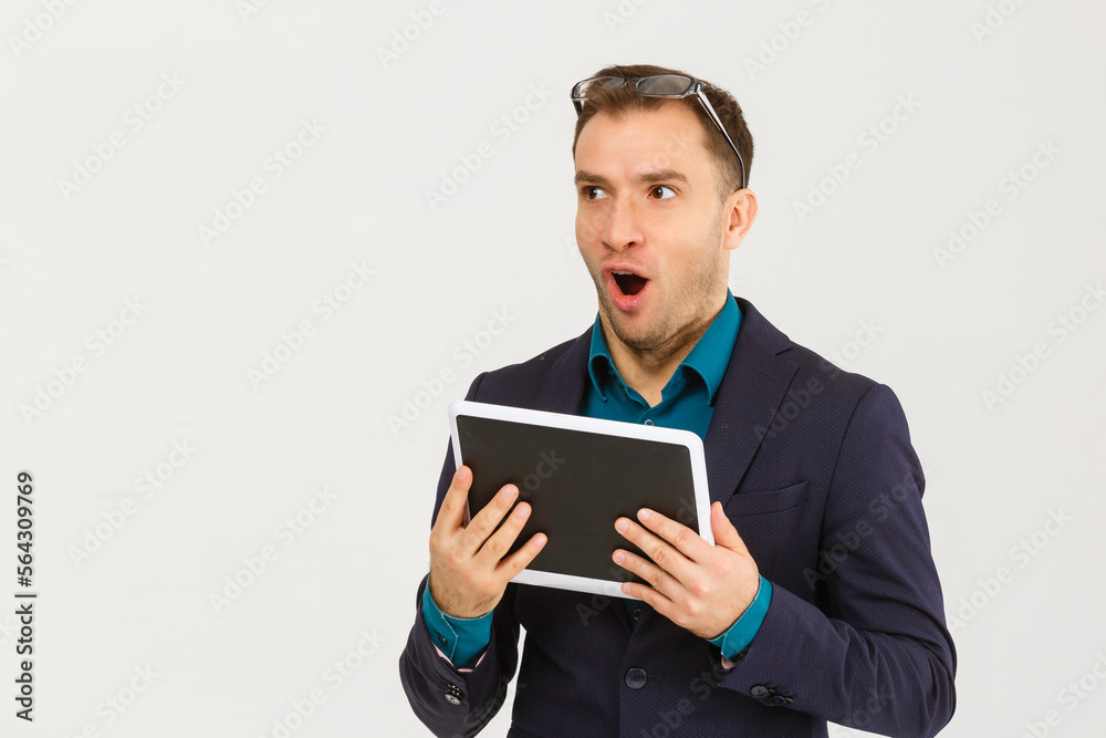 Businessman using a tablet computer - isolated over a white background
