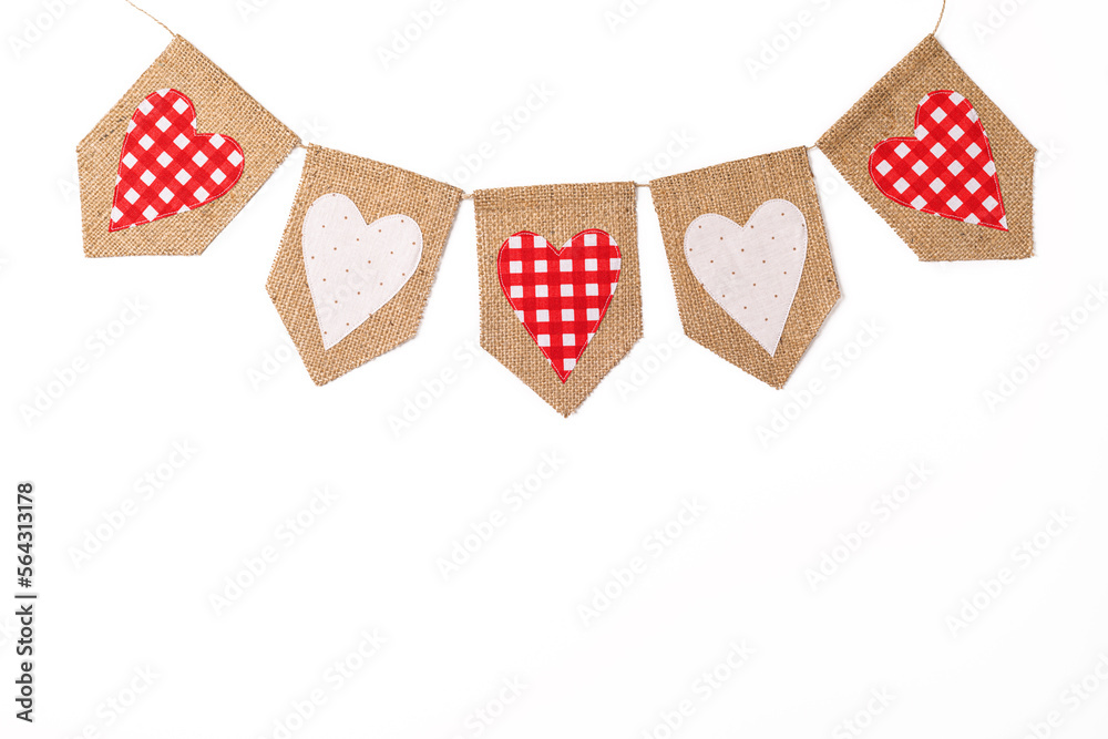 Obraz premium Valentine's Day background. Vintage cute love garland with red hearts on white background. Happy Valentines Day card. Valentines day concept. Flat lay, top view. Copy space