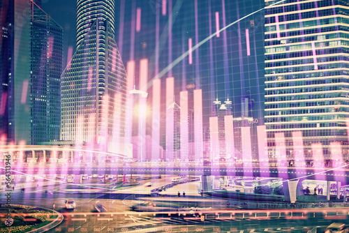 Financial chart on city scape with tall buildings background multi exposure. Analysis concept. © peshkova