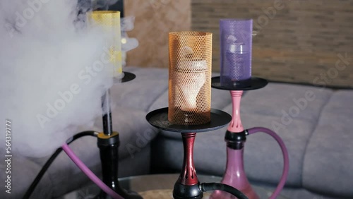 Slow motion video of  smoke from a hookah. Close-up of  beautiful hookahs that are standing 
