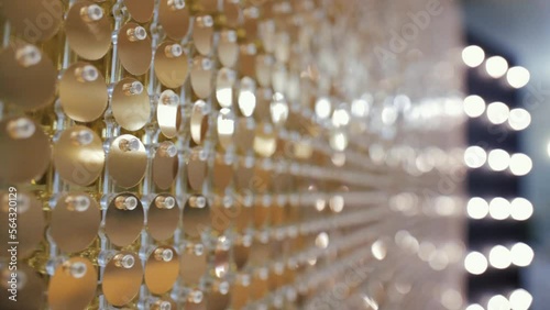 Slow motion video of the light bulbs that decorate the atmosphere of the festive hall close-up of holiday decoration lights