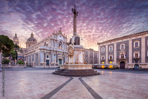 Catania, Sicily, Italy. Cityscape image of Duomo Square in Catania, Sicily with Cathedral of Saint Agatha at sunrise. photo