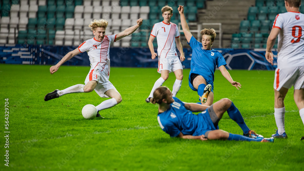 Obraz premium Professional Soccer Football Match Championship: White Team Players Attacks, Blue Player Tries to Tackle. Action Game on International Tournament. Sport Broadcast Channel Television Broadcast Concept.