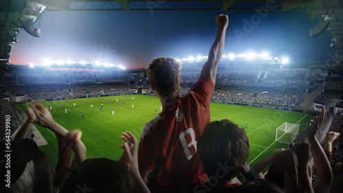 Establishing Shot of Fans Cheer for Their Team on a Stadium During Soccer Championship Match. Teams Play  Crowds of Fans Scream  Celebrate Victory  Goal. Football Cup Tournament Concept. Wide Shot