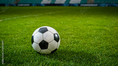 Close-up of a Football Ball. Conceptual Shot Representing Start of the Game, Success, Victory, Determination in Sport and Life. Low Angle Ground Artistic Shot. Establishing Shot © Gorodenkoff