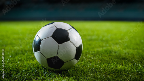 Close-up of a Football Ball. Conceptual Shot Representing Start of the Game, Success, Victory, Determination in Sport and Life. Low Angle Ground Artistic Shot. Beautiful Establishing Shot