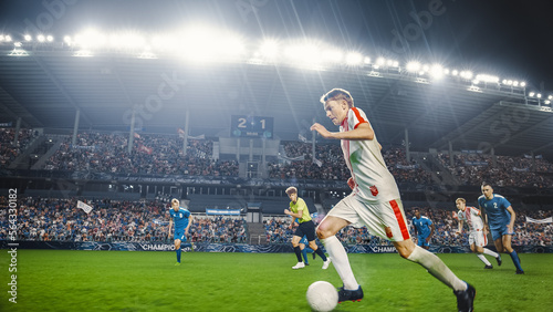 Professional Soccer Football Match Championship: White Team Attacks, Caucasian Forward Dribbles on an International Tournament. Stadium Crowd of Fans Cheers. Cinematic Beautiful Edit. © Gorodenkoff