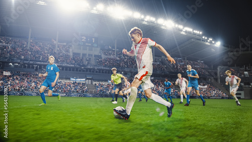Professional Soccer Football Match Championship: White Team Attacks, Caucasian Forward Dribbles on an International Tournament. Stadium Crowd of Fans Cheers in Support. Cinematic Beautiful Edit. © Gorodenkoff