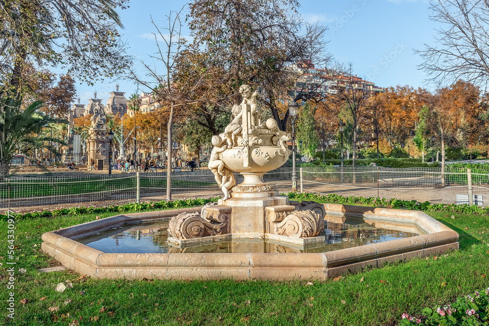 Fountain Font dels Nens by Josep Reynes i Gurgui, 1893, in Parc de la Ciutadella in Barcelona, Spain. Ancient Vase with children or Gerro amb nens sculpture inside the water pool on a sunny autumn day