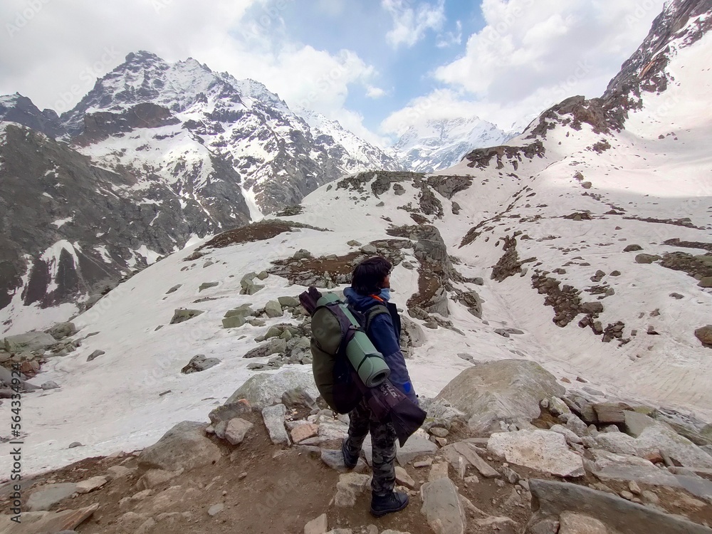 Himachal, India - June 9th, 2022 : Active hiker enjoying the view of Himalayas in Hampta Trek