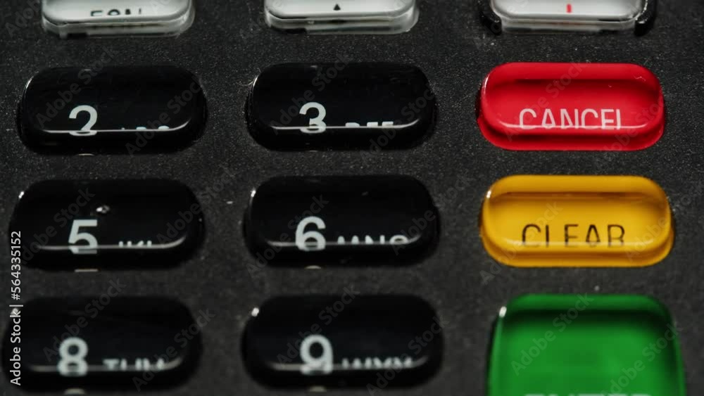 Close up of NFC terminal in the shop. Macro shot of Men pays by card in banking terminal. Close up of NFC terminal in the shop. Macro shot of Men pays by card in banking terminal.