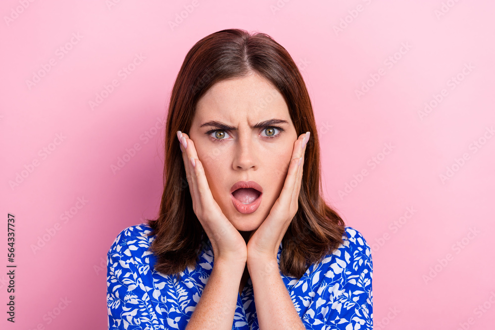 Photo of shocked impressed lady wear print shirt arms cheeks open mouth isolated pink color background Photo of shocked impressed lady wear print shirt arms cheeks open mouth isolated pink color background