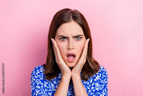 Photo of shocked impressed lady wear print shirt arms cheeks open mouth isolated pink color background