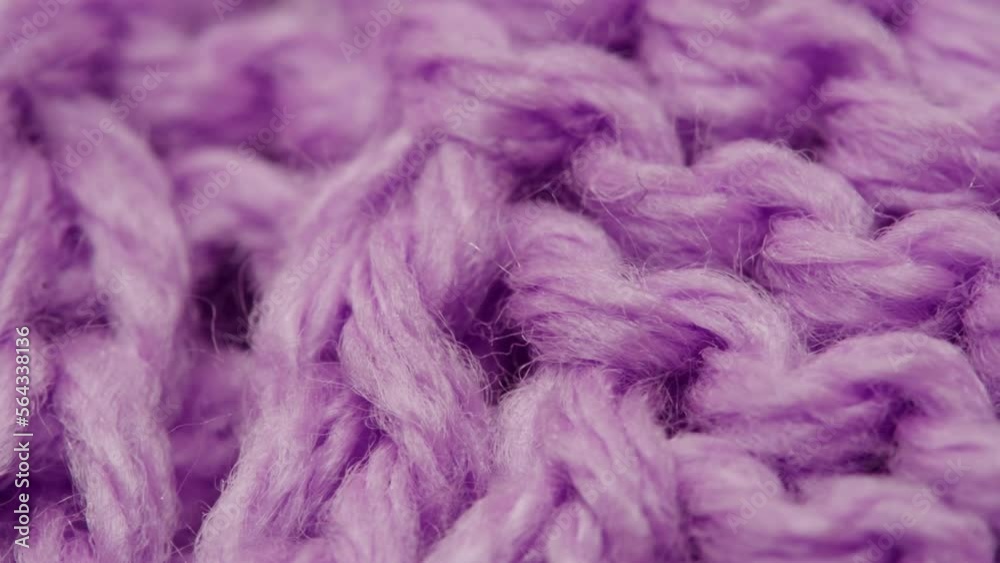 Knitted purple woman warm grey sweater or scarf, textile macro of Wool fabric texture close up background Knitted purple woman warm grey sweater or scarf, textile macro of Wool fabric texture close up background