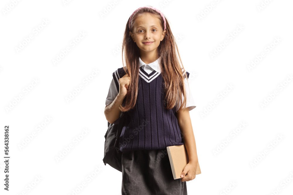Girl in a school uniform carrying a backpack and a book Girl in a school uniform carrying a backpack and a book