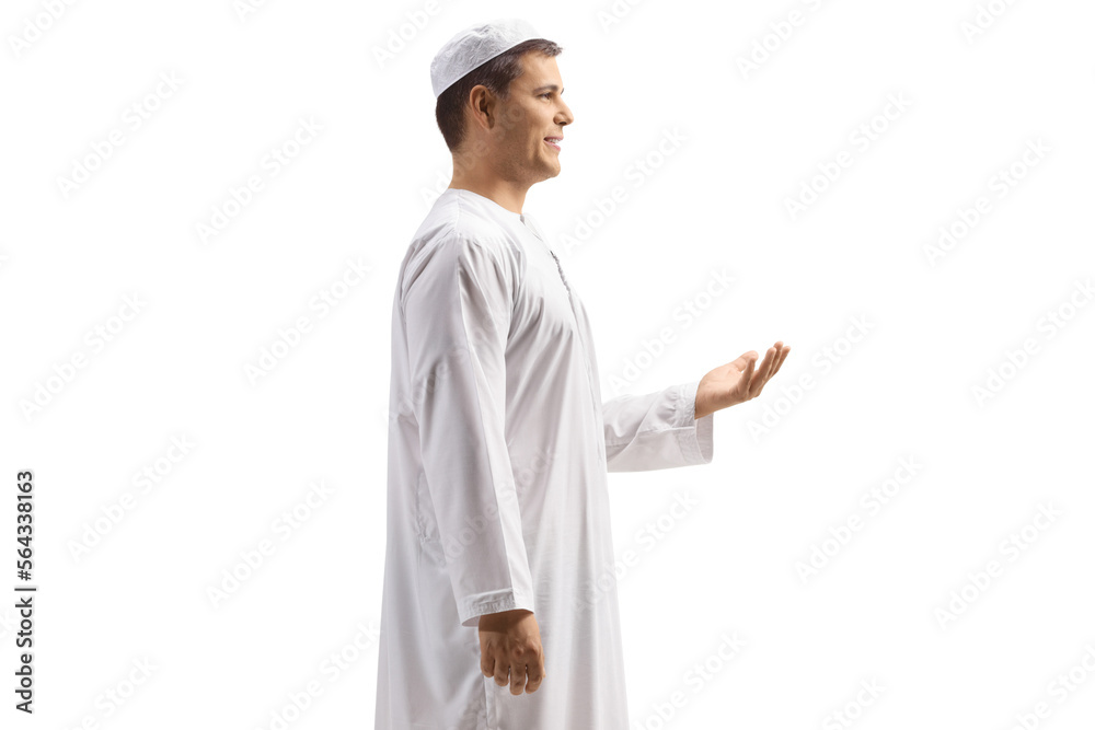 Profile shot of a young man in white ethnic clothes gesturing with hands Profile shot of a young man in white ethnic clothes gesturing with hands