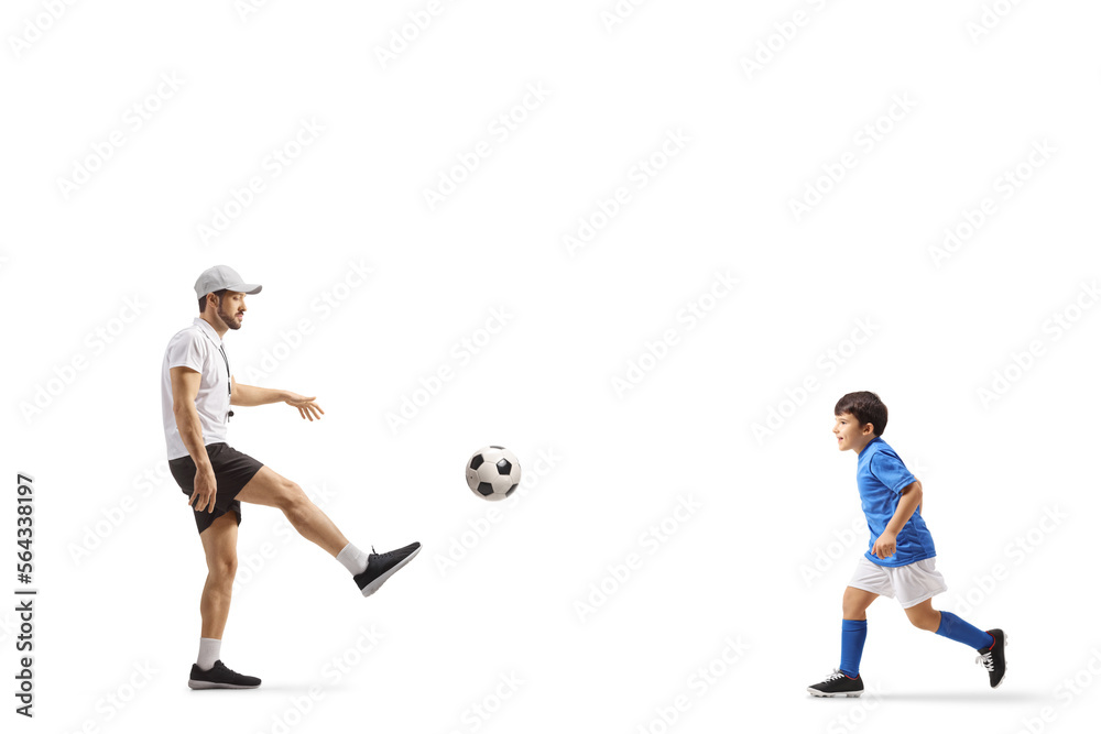 SPorts coach playing football with a boy SPorts coach playing football with a boy