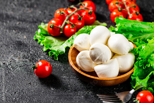 Mozzarella cheese with cherry tomatoes and lettuce. 