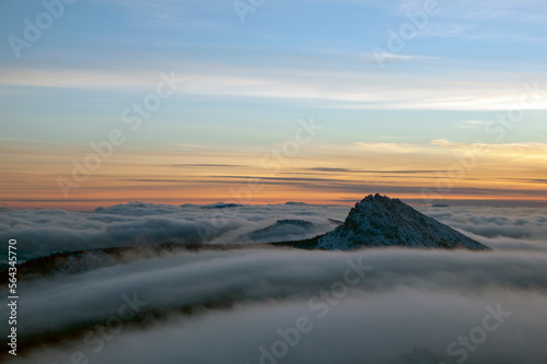 the top of the mountain above the clouds