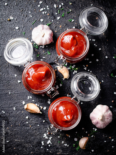 Jars of tomato sauce with garlic and salt. 